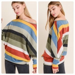 Striped long sleeve top with a boat neckline.